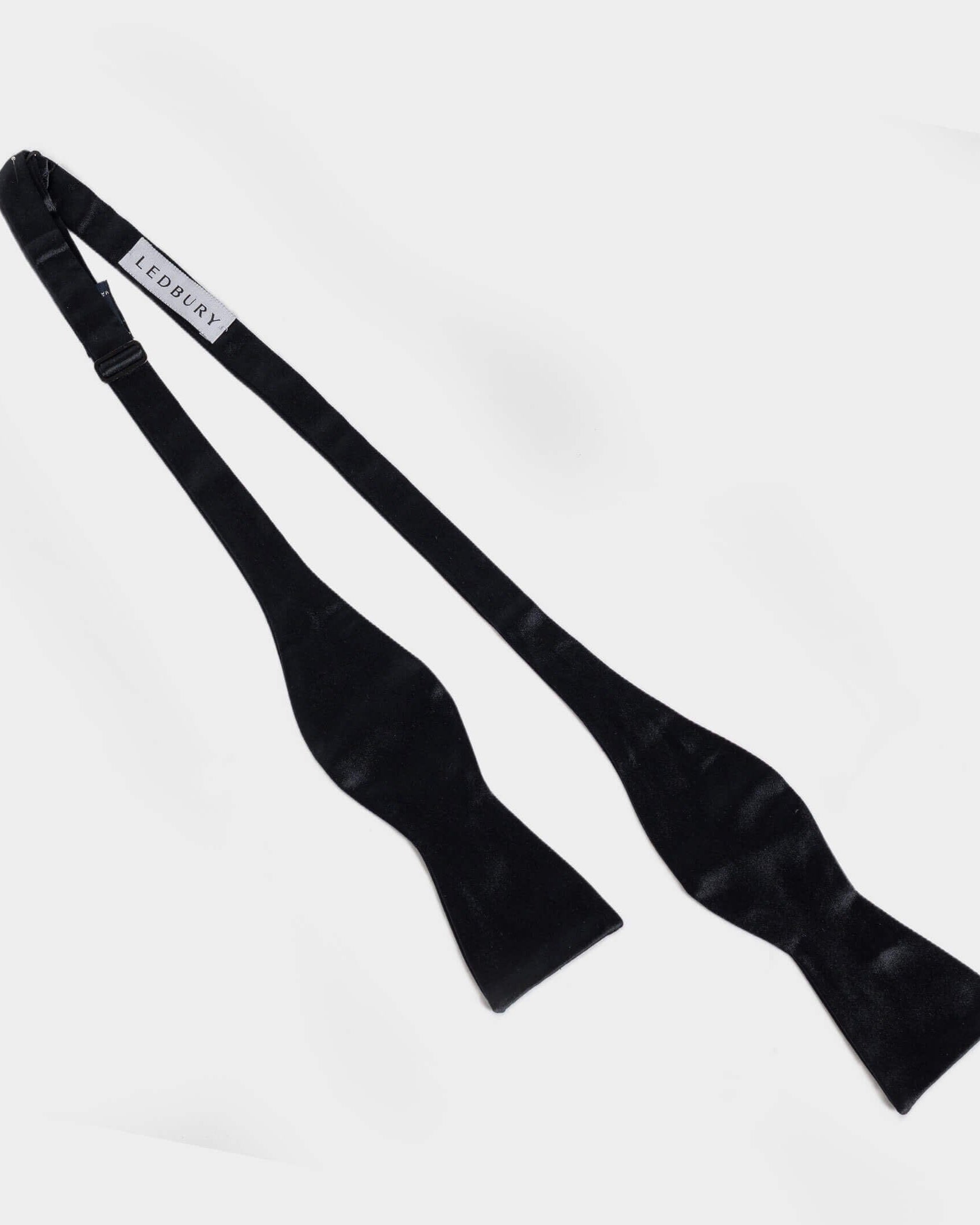 Black Carlo silk bow tie detail view — satin weave finish by Ledbury