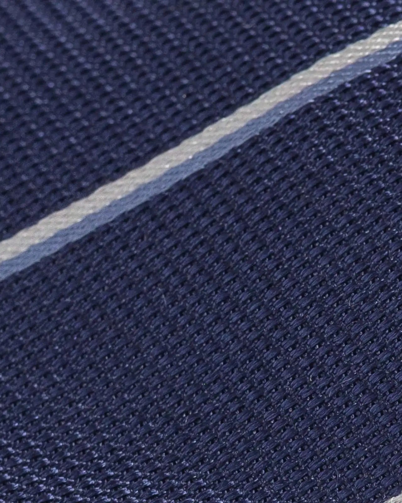 Close-up of Ledbury Navy Abate Stripe Silk Tie showing jacquard weave texture and sheen