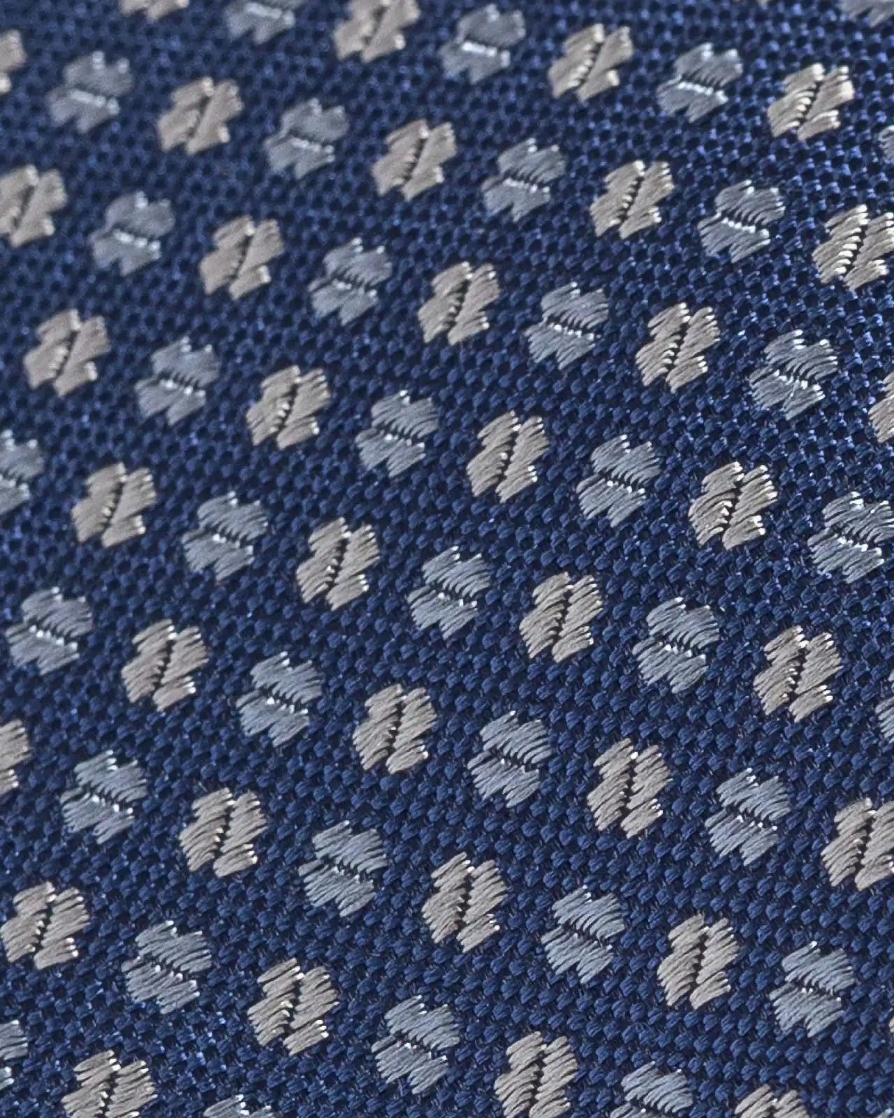 Close-up of Ledbury Blue Spada Silk Cotton Tie showing satin weave texture and sheen