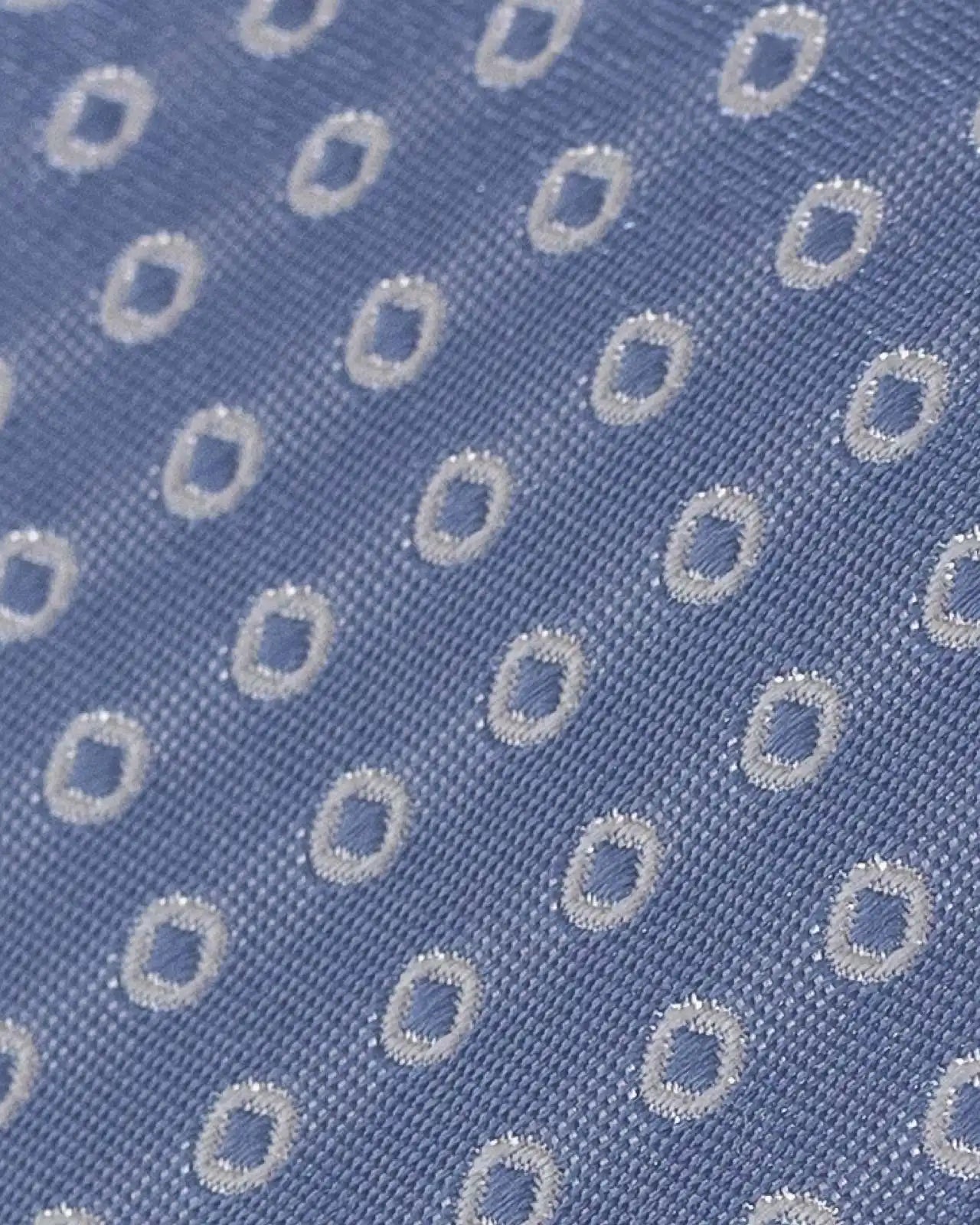 Close-up of Ledbury Light Blue Fonda Dot Silk Tie showing jacquard dot pattern and sheen