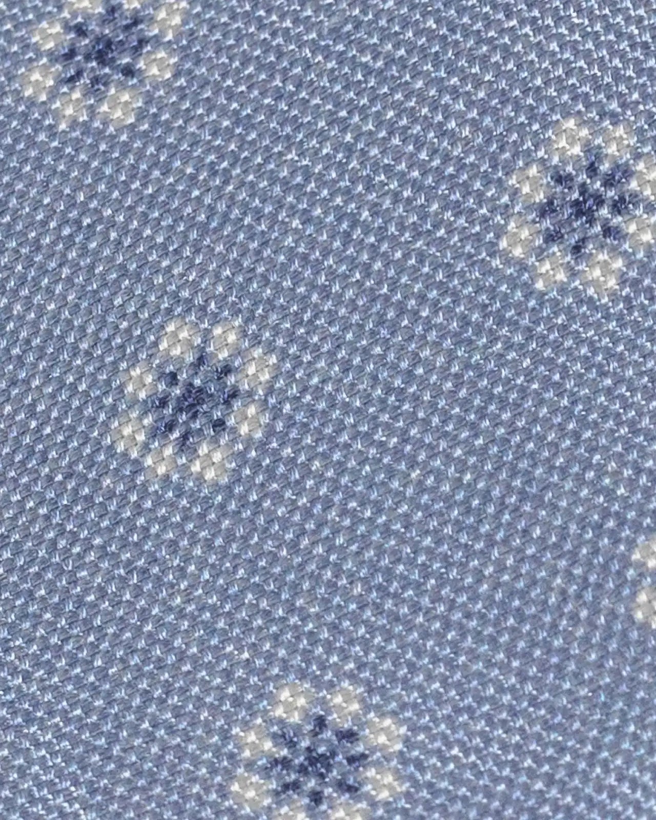 Close-up of Ledbury Light Blue Moretti Floral Silk Tie showing printed floral pattern and sheen
