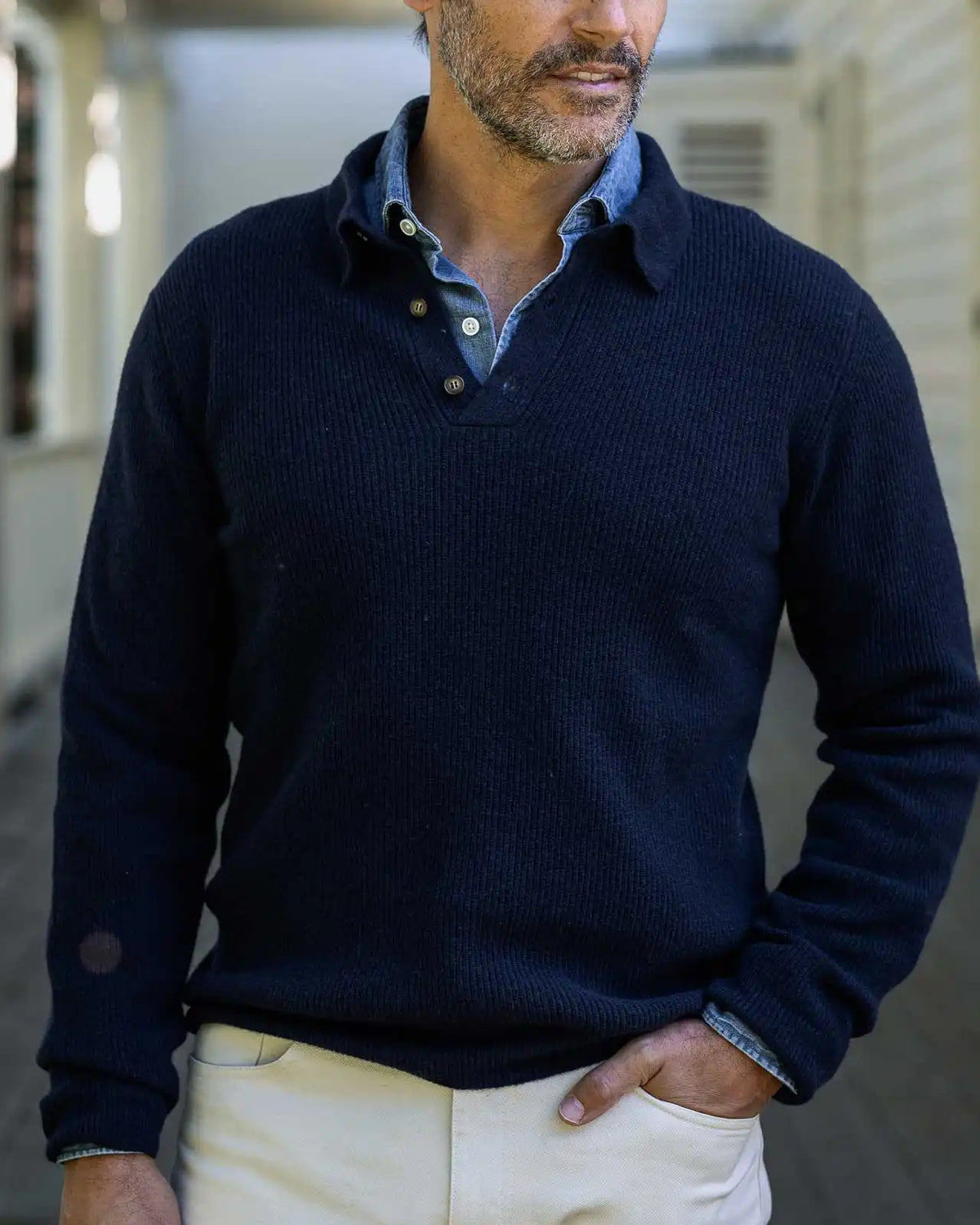 Men's Navy Atwood polo sweater styled with chinos — lifestyle shot