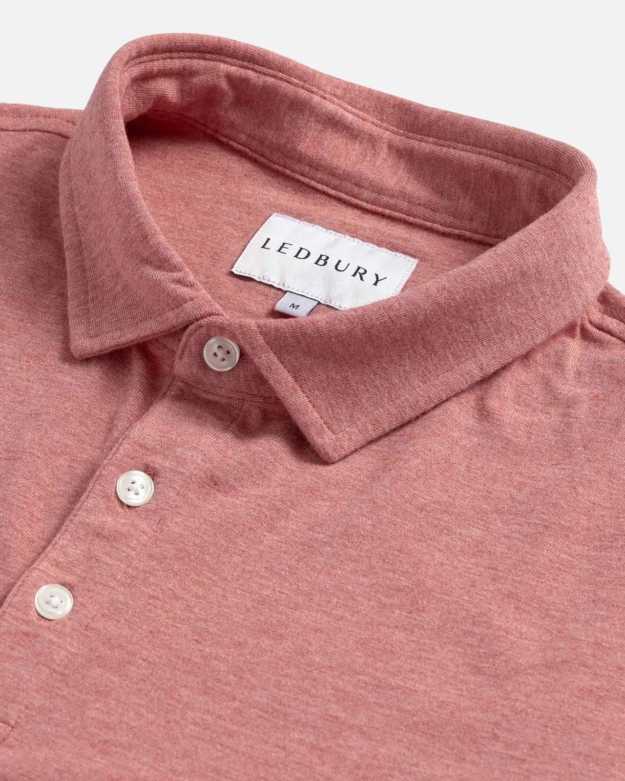 Close-up of the collar on the Ledbury Freeman Knit Custom Polo in Washed Red