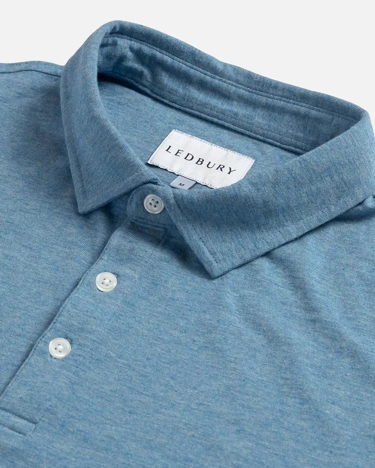 Close-up of the collar on the Ledbury Freeman Knit Custom Polo in Light Blue