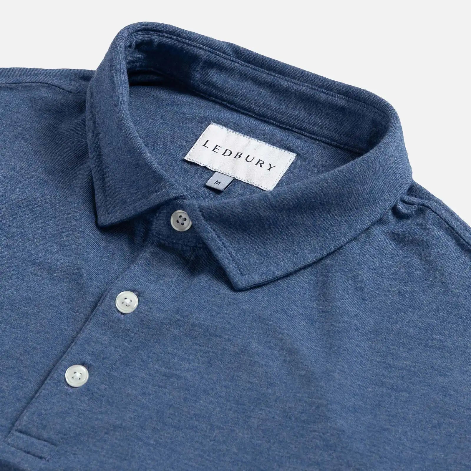 Close-up of the collar on the Ledbury Freeman Knit Custom Polo in Blue