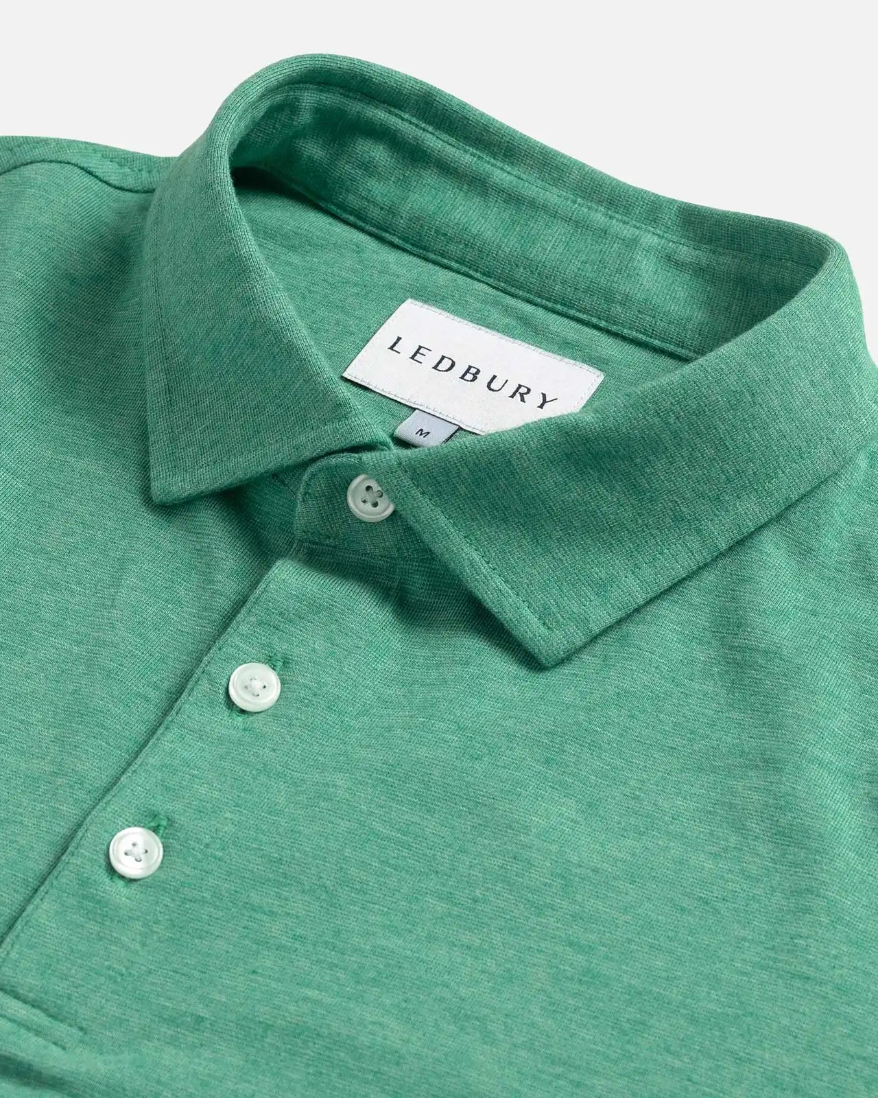 Close-up of the collar on the Ledbury Freeman Knit Custom Polo in Parakeet Green