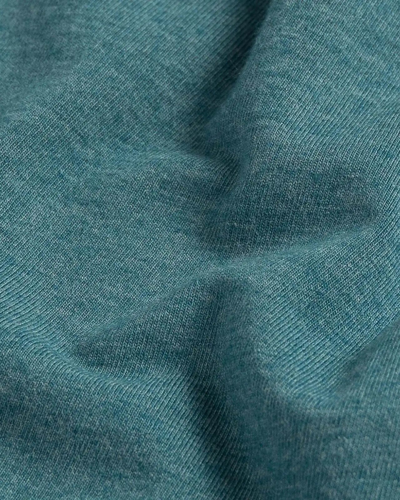 Fabric detail of the Ledbury Freeman Knit Custom Polo — cotton-modal jersey knit in Teal