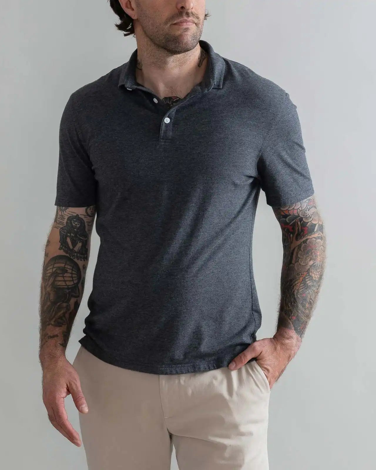 Model wearing the Ledbury Freeman Knit Custom Polo in Charcoal Grey