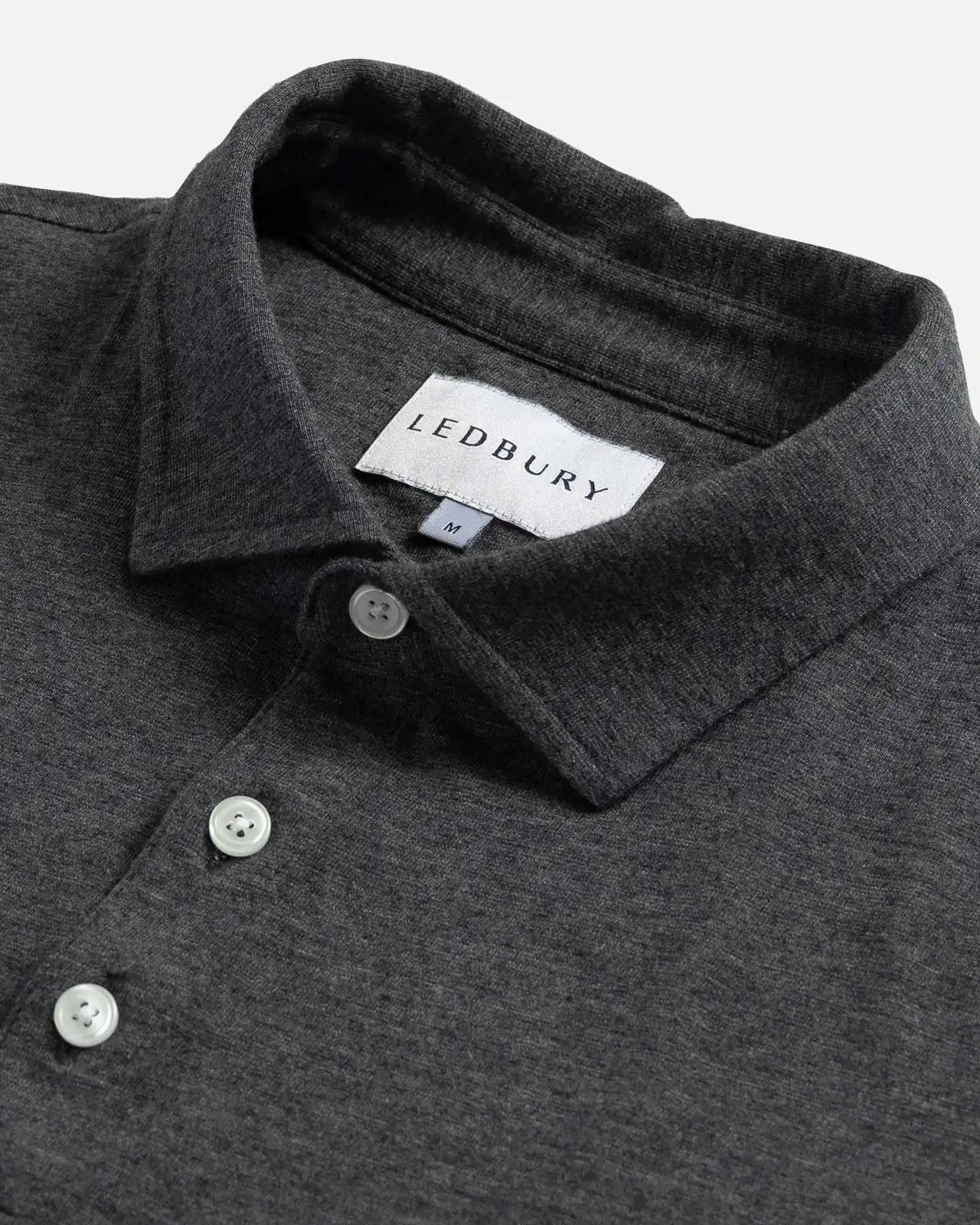 Close-up of the collar on the Ledbury Freeman Knit Custom Polo in Charcoal Grey