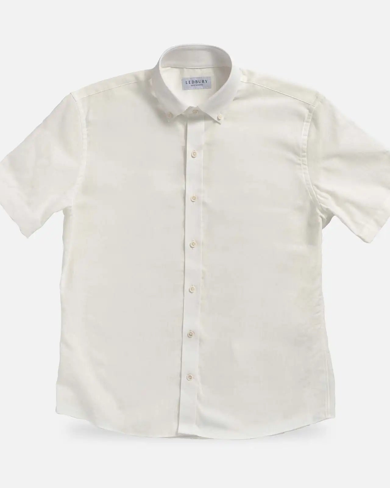 Cream Sandoval Oxford Chambray short sleeve shirt laid flat — slub cotton fabric detail, Ledbury