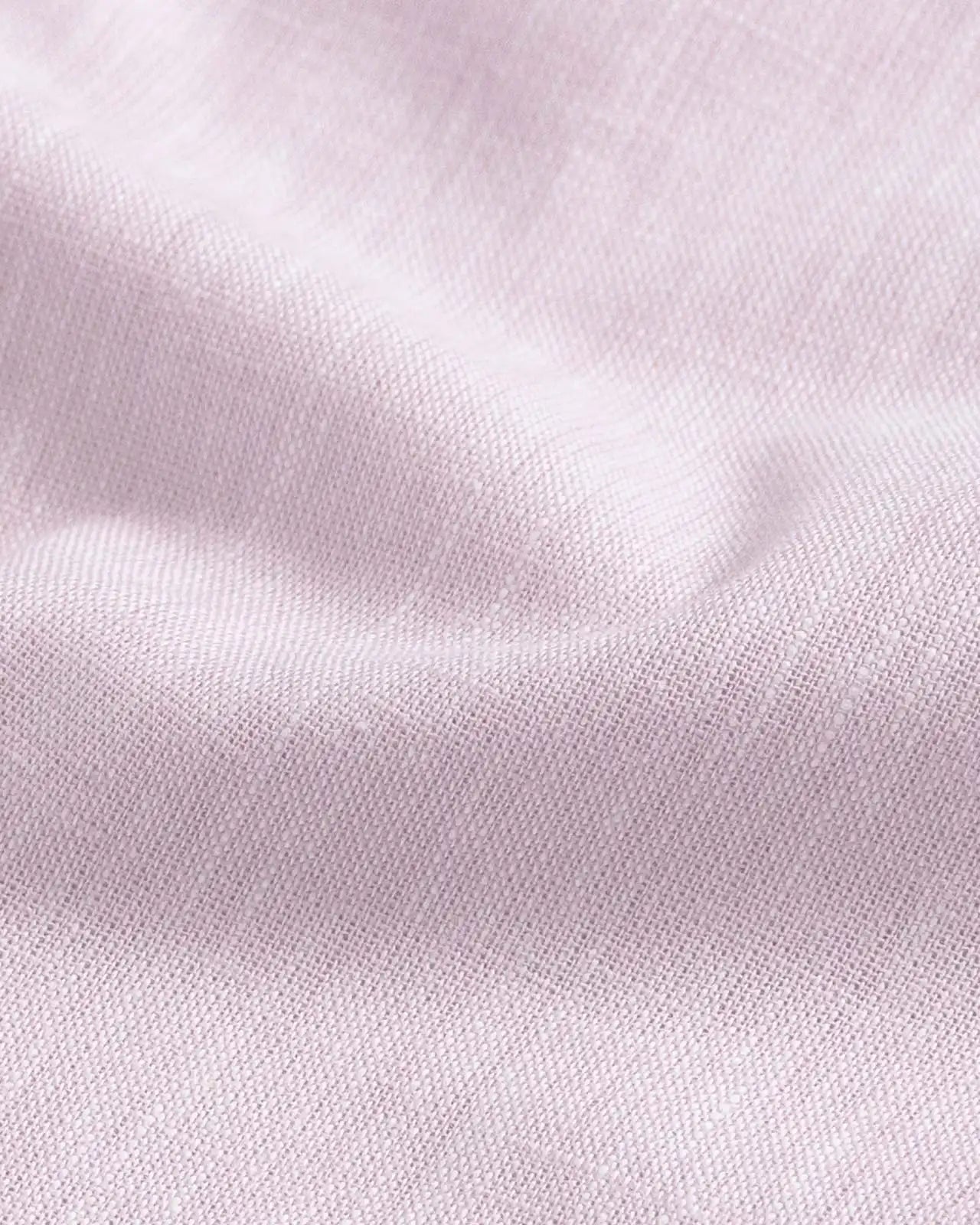 Close-up of slub cotton oxford chambray fabric — subtle heathered texture on the Pink Sandoval