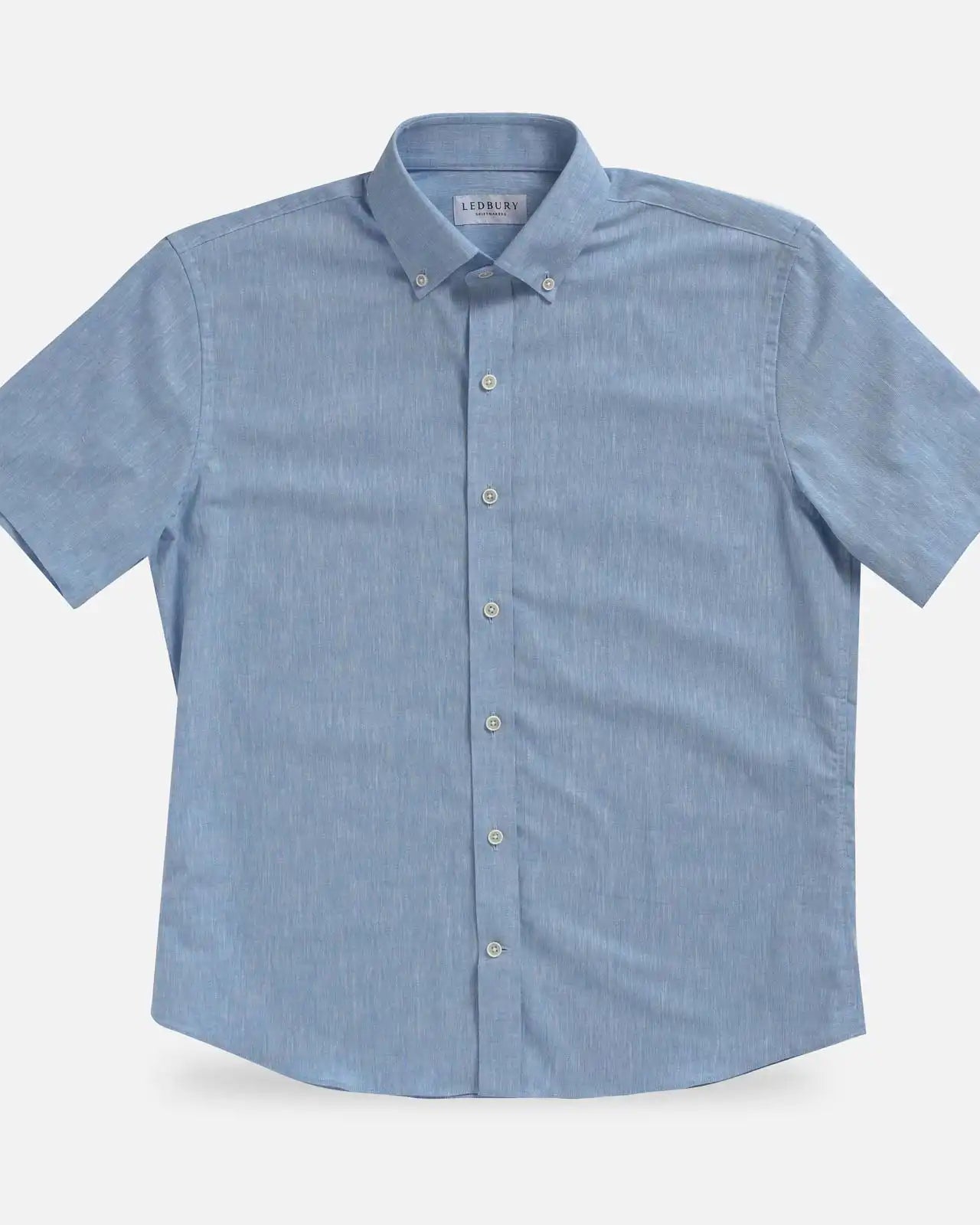 Light Blue Sandoval Oxford Chambray short sleeve shirt laid flat — slub cotton fabric detail, Ledbury