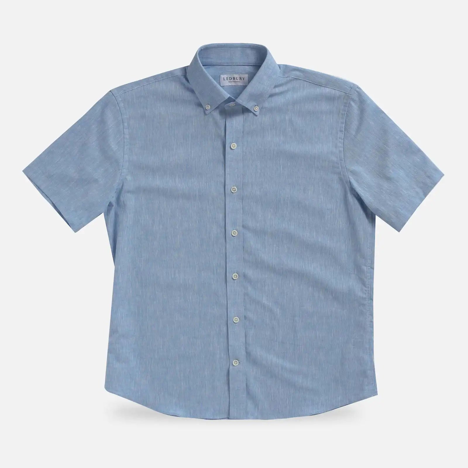 Light Blue Sandoval Oxford Chambray short sleeve shirt laid flat — slub cotton fabric detail, Ledbury