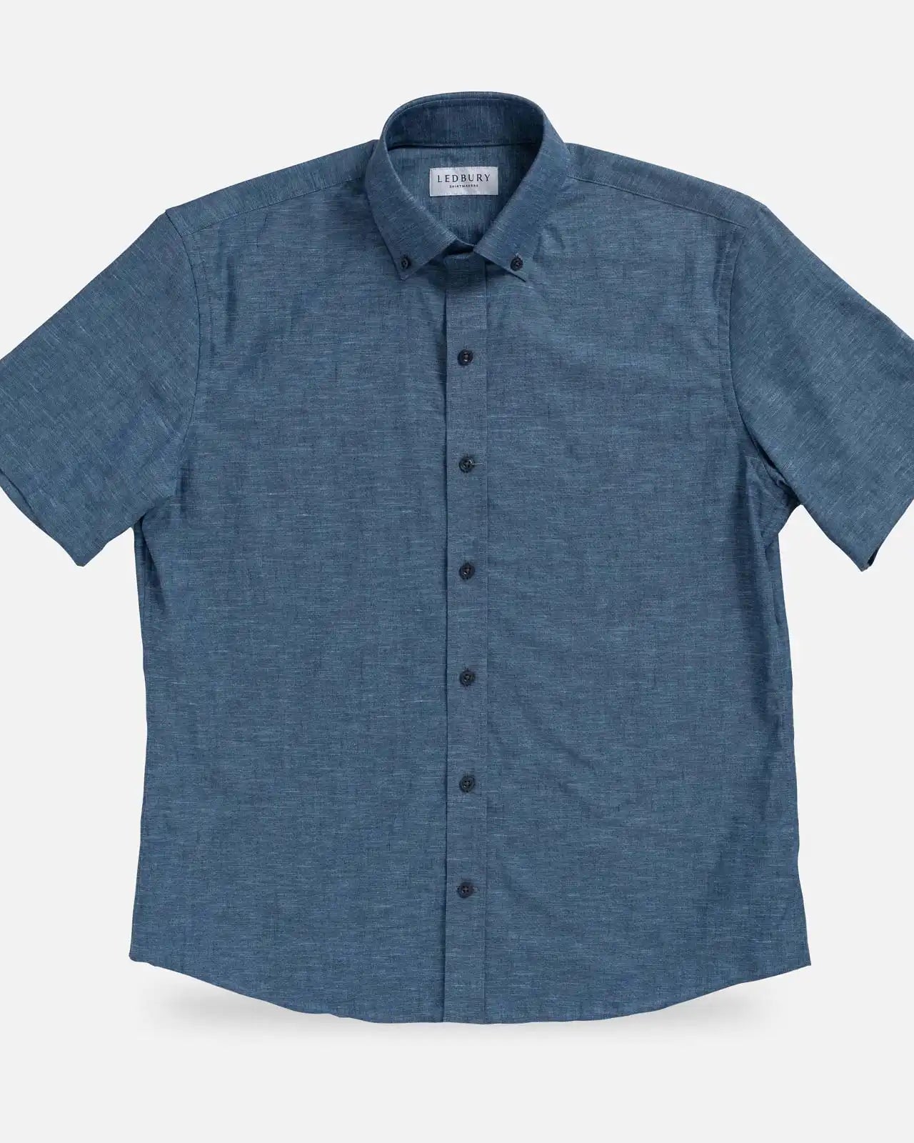Medium Blue Sandoval Oxford Chambray short sleeve shirt laid flat — slub cotton fabric detail, Ledbury