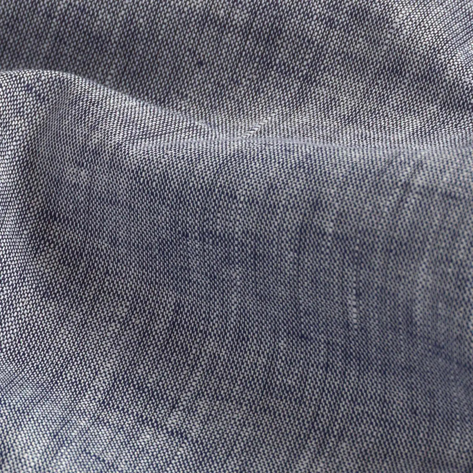 Close-up of slub cotton oxford chambray fabric — subtle heathered texture on the Navy Blue Sandoval