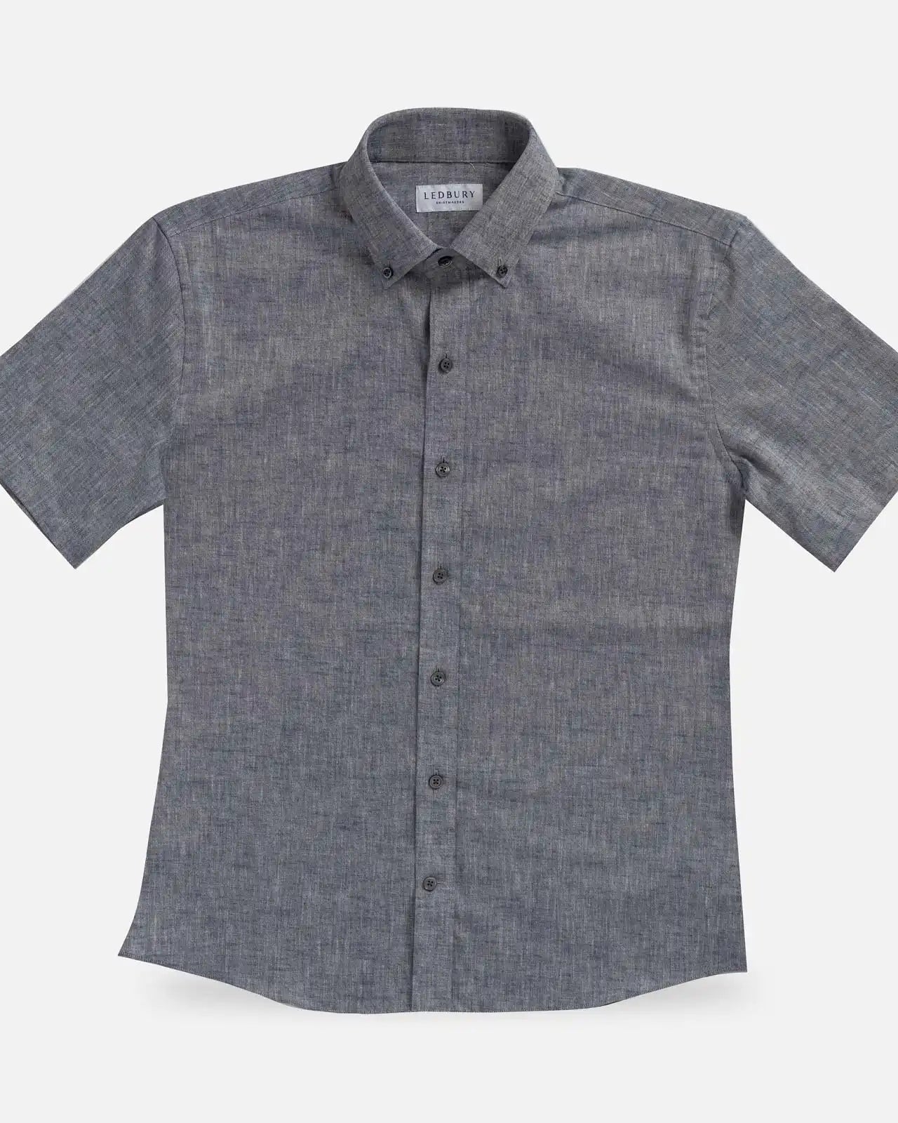 Navy Blue Sandoval Oxford Chambray short sleeve shirt laid flat — slub cotton fabric detail, Ledbury