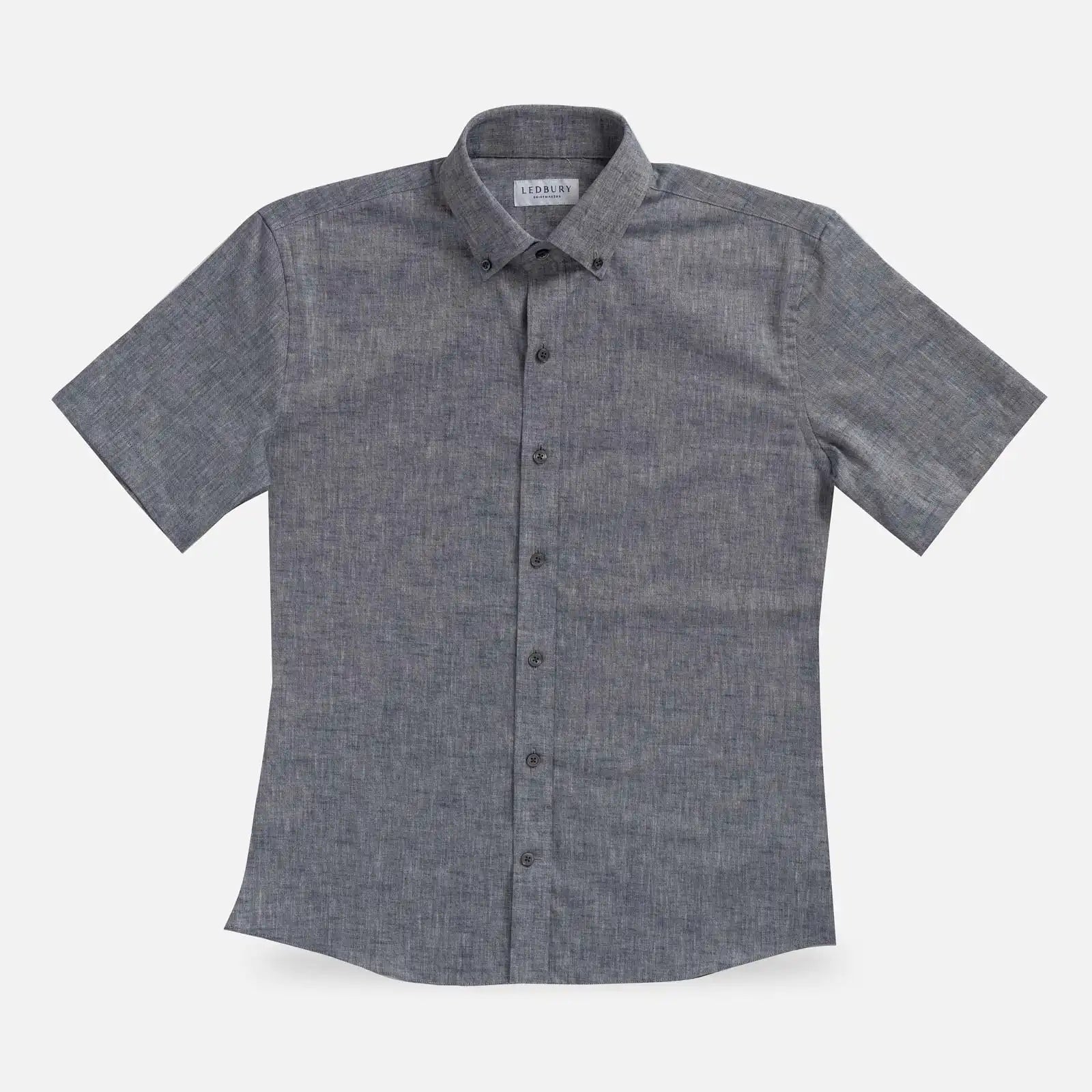 Navy Blue Sandoval Oxford Chambray short sleeve shirt laid flat — slub cotton fabric detail, Ledbury