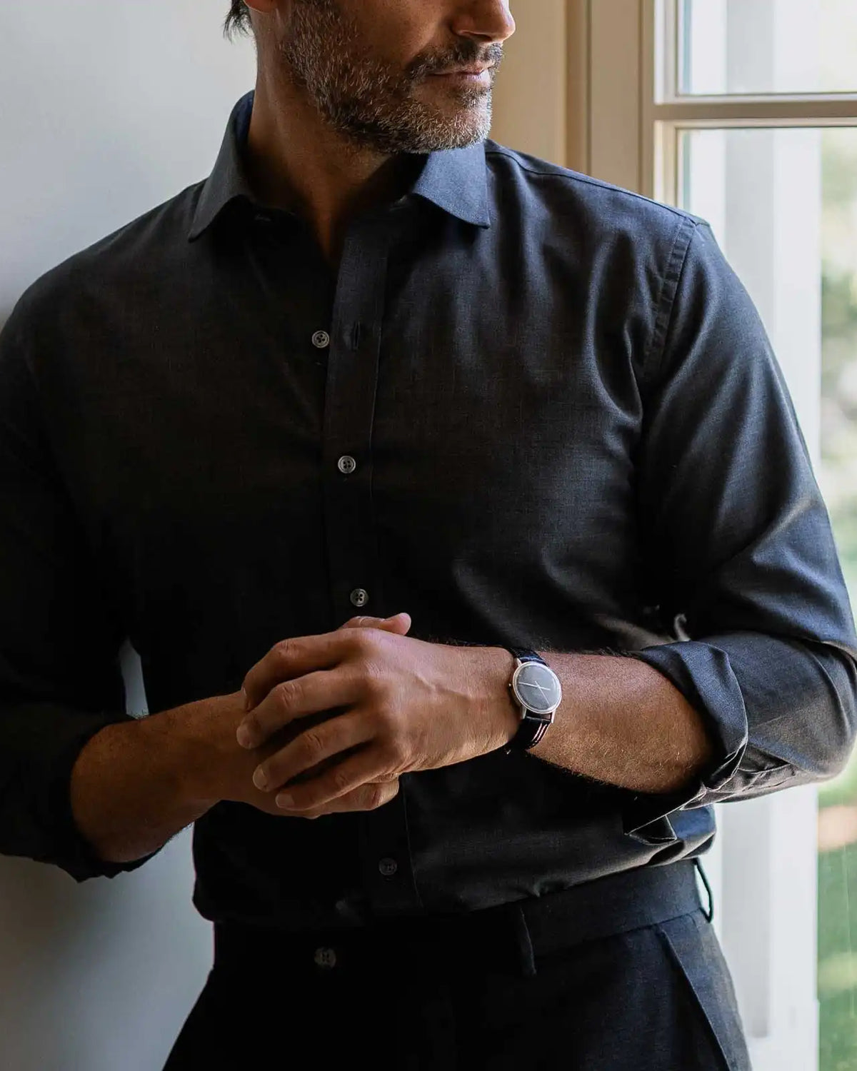 Charcoal Reda Merino shirt on a model- 100% New Zealand wool with natural stretch