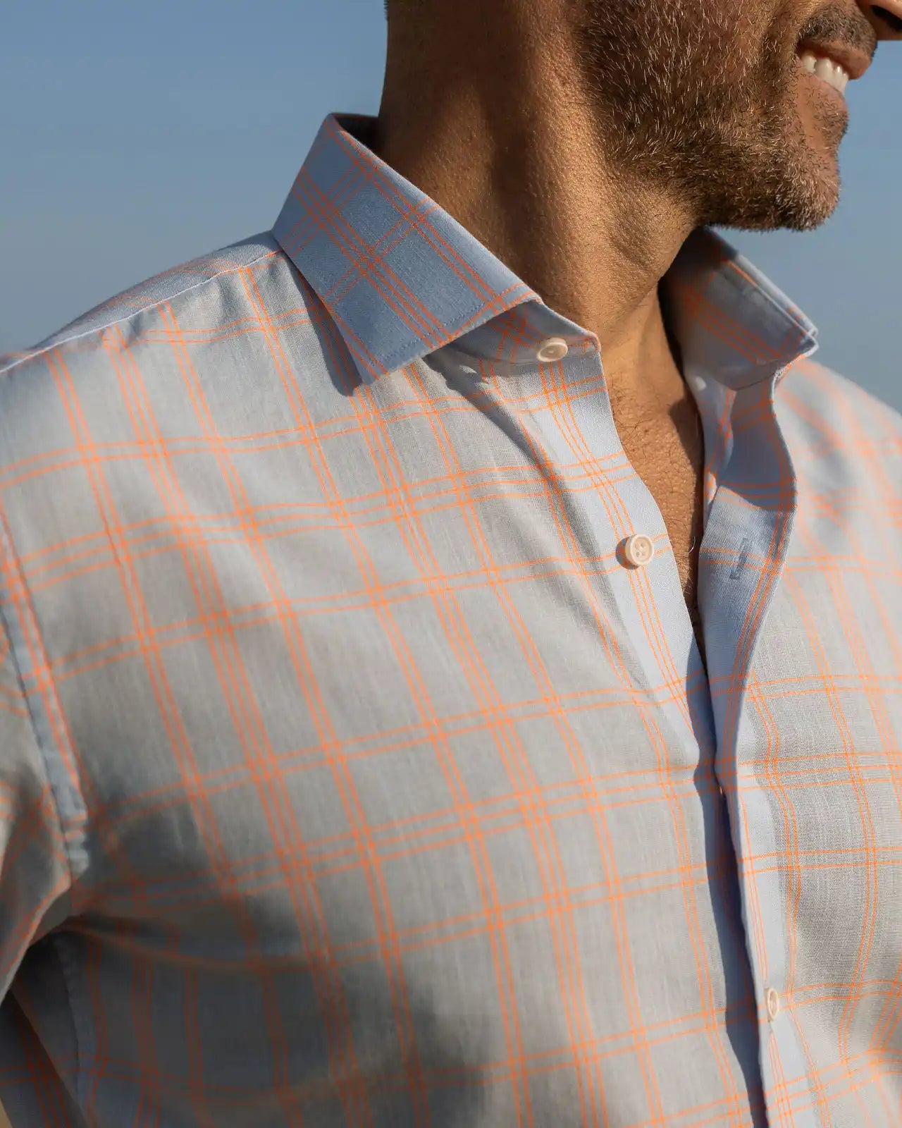 Close-up of man wearing the Ledbury Light Blue Torello Check custom shirt