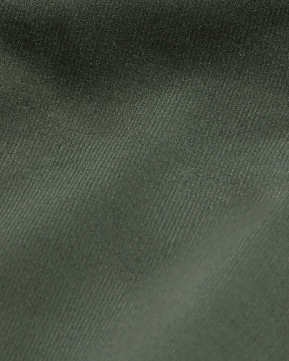 A close-up of dark olive green fabric with a fine ribbed texture and soft folds.