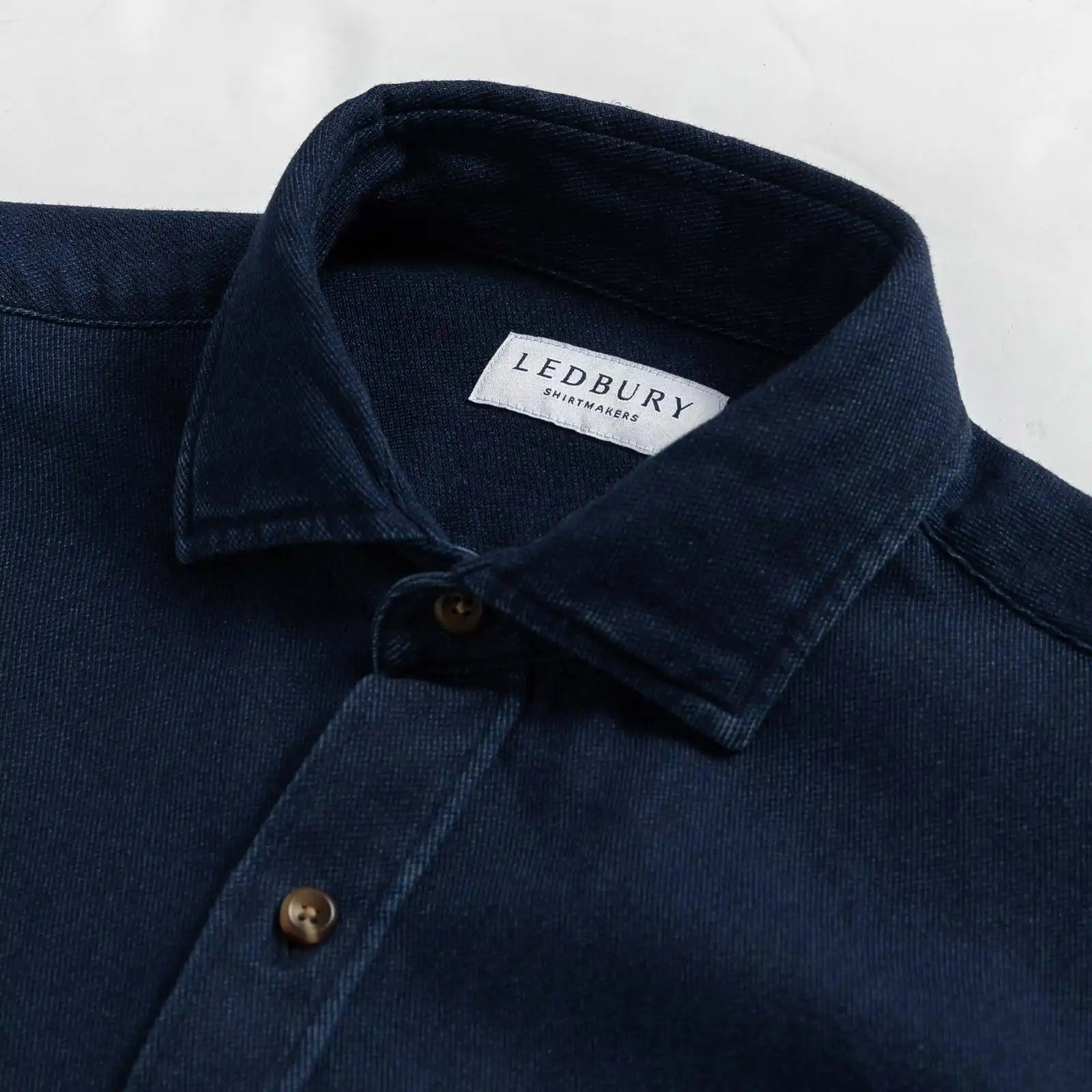 Indigo denim utility shirt collar detail - double button-through design