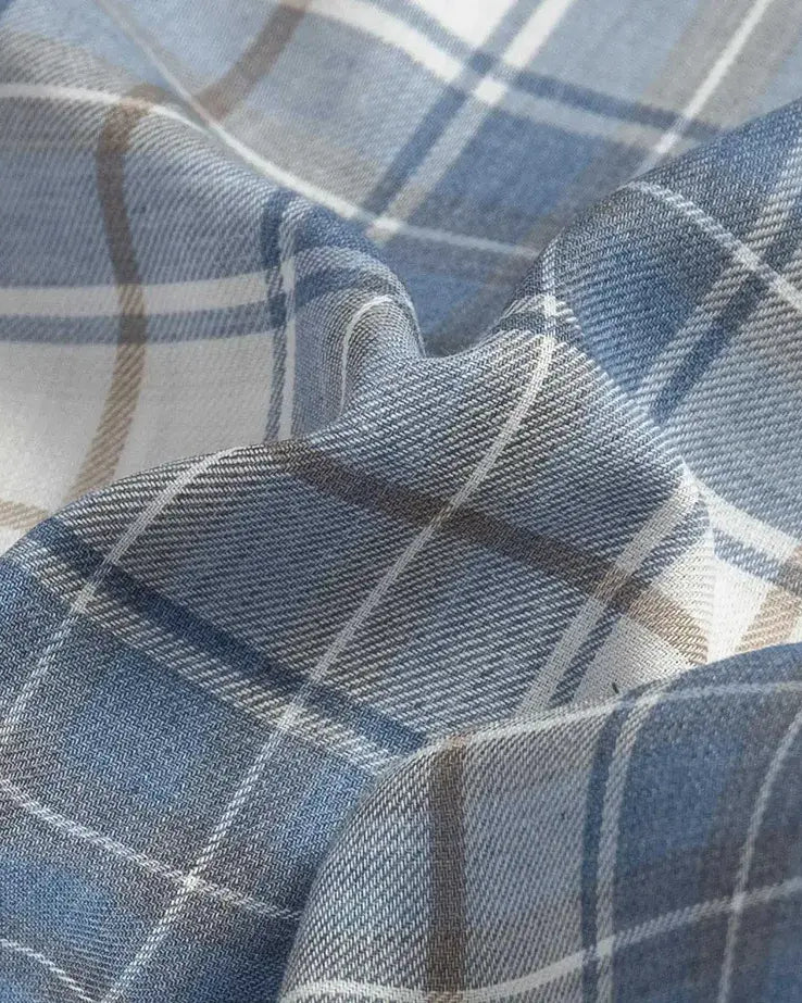 Fabric detail of the Ledbury Faded Blue Coulter Plaid Custom Shirt — lightweight Japanese recycled polyester and organic cotton blend