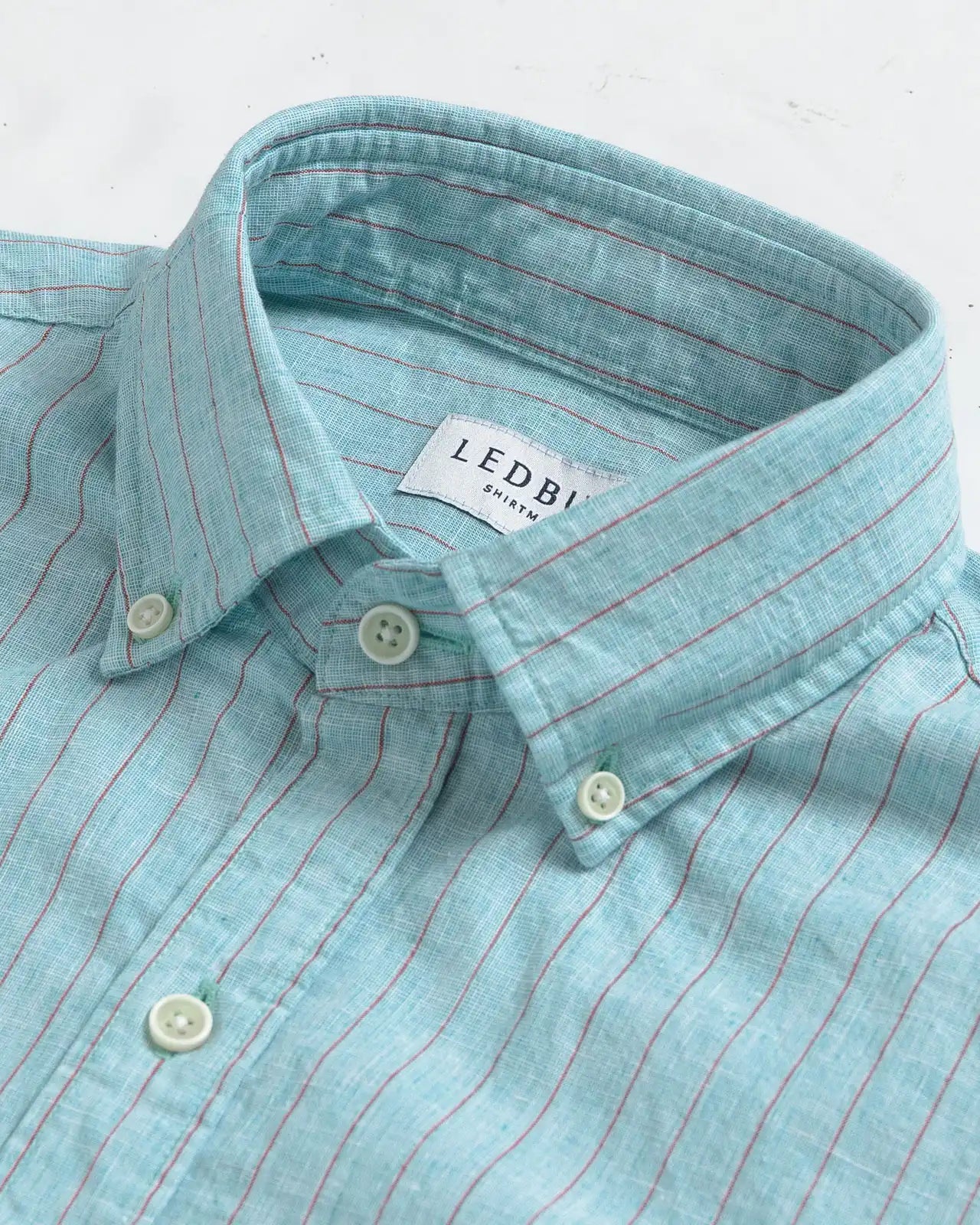 Close-up of collar detail on the Sea Green Barretto Stripe cotton-linen shirt