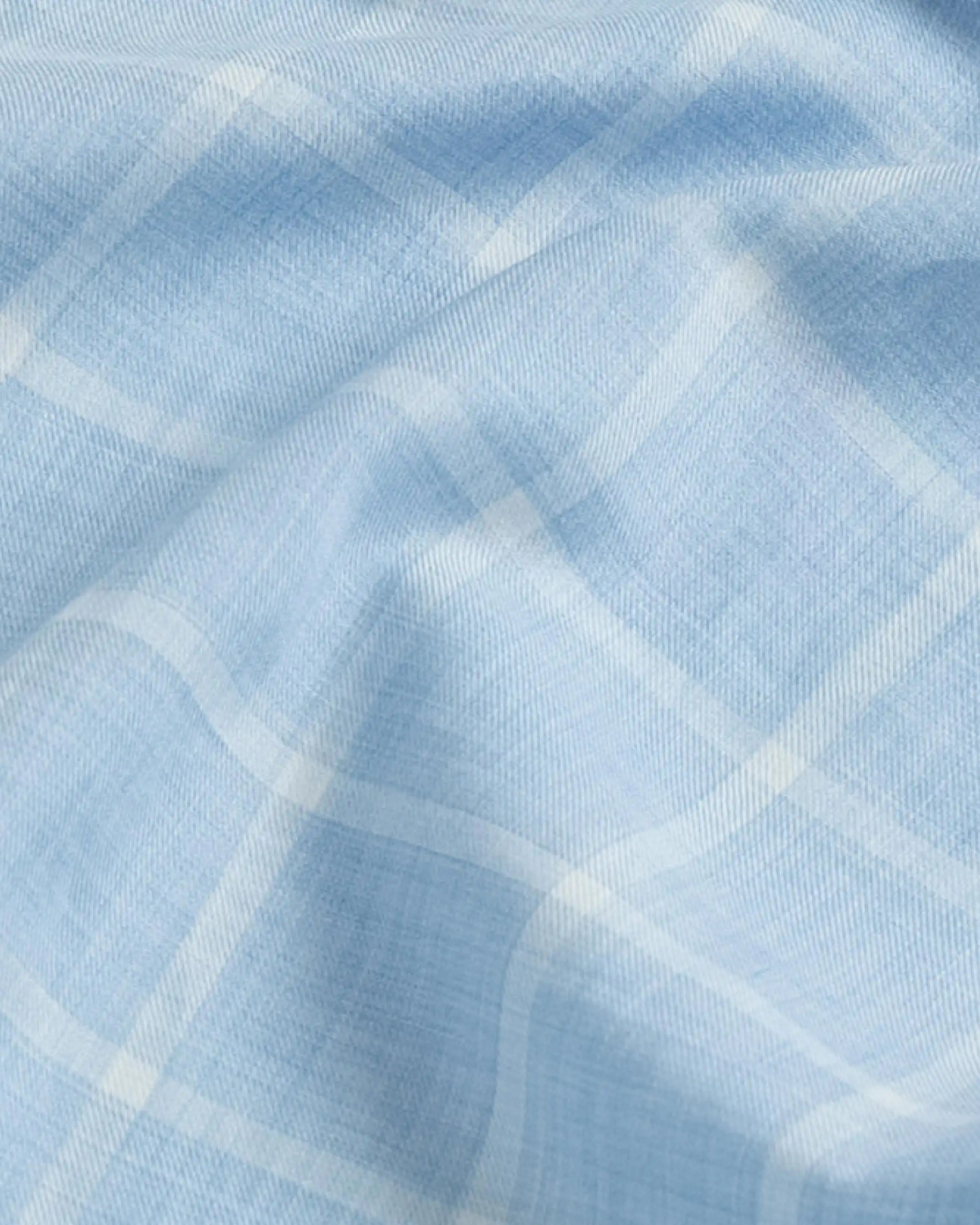 Close-up fabric detail of the blue Albini Pritchard Italian checkered dress shirt