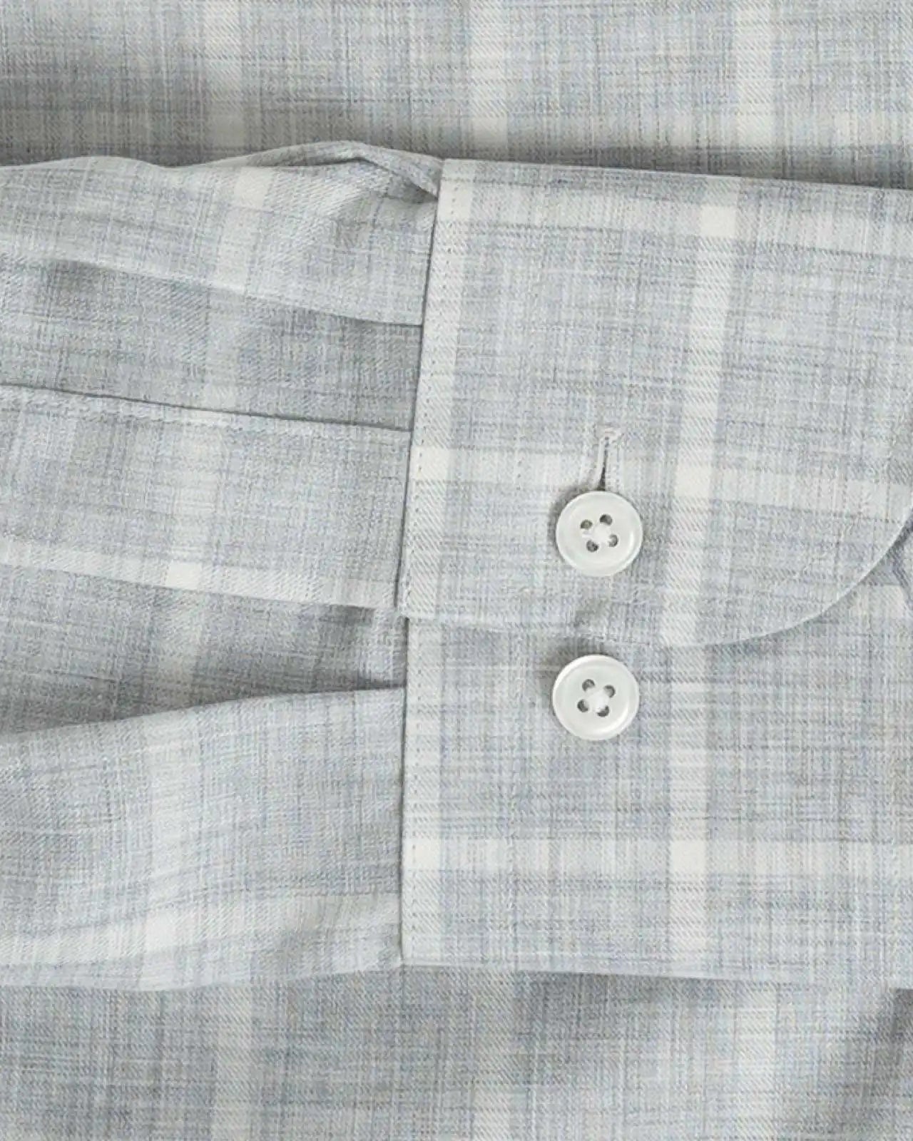 Sleeve detail of an Italian Albini light grey and white checkered button down shirt
