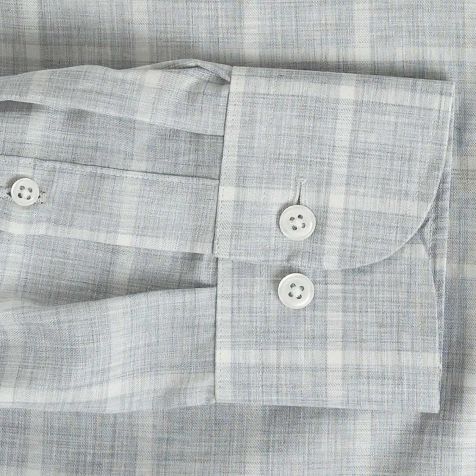 Sleeve detail of an Italian Albini light grey and white checkered button down shirt
