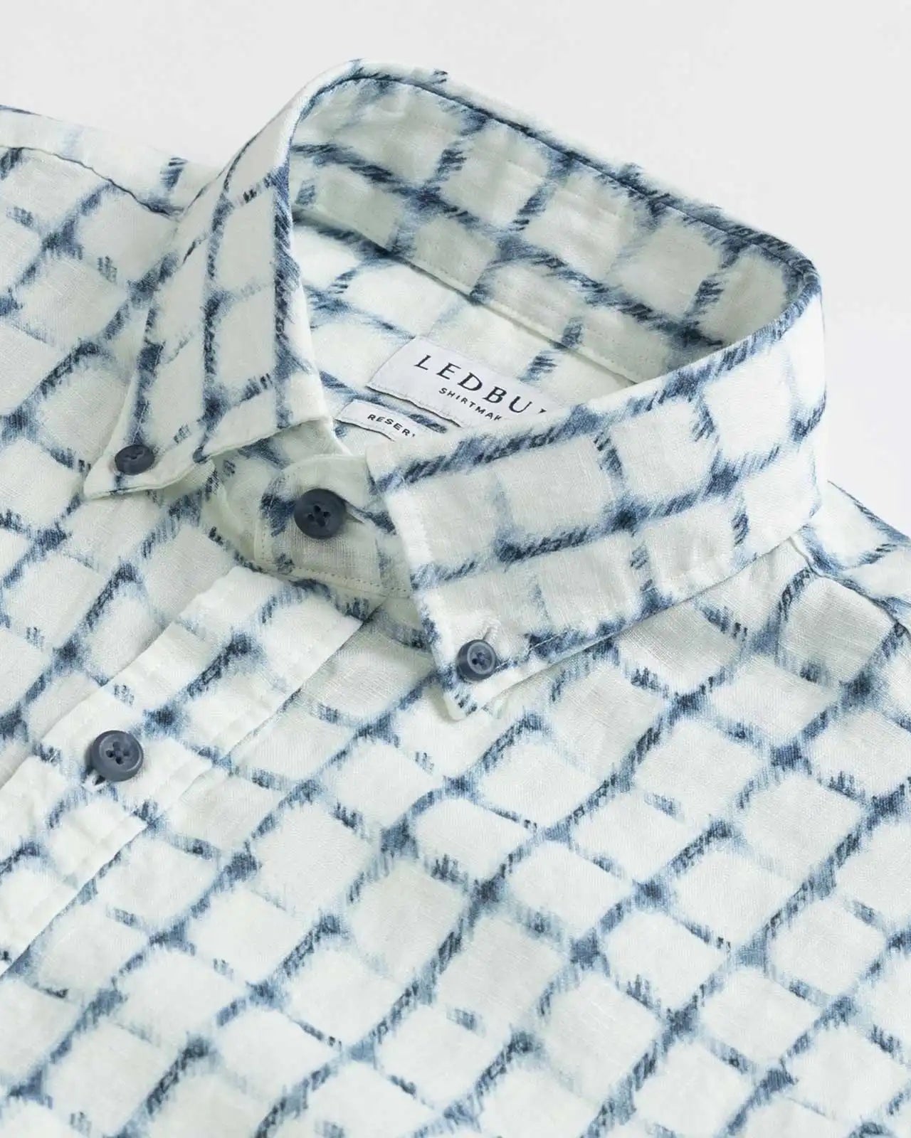 Collar detail of Italian linen white and navy check shirt