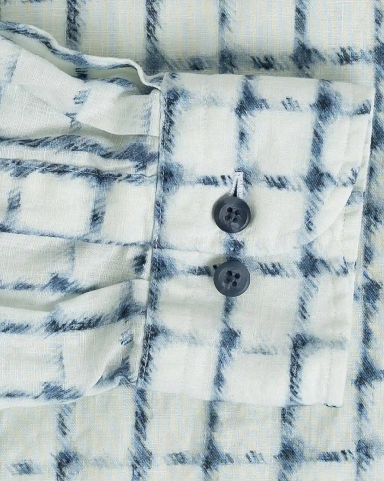 Close-up of an Italian linen check shirt with blue and white pattern