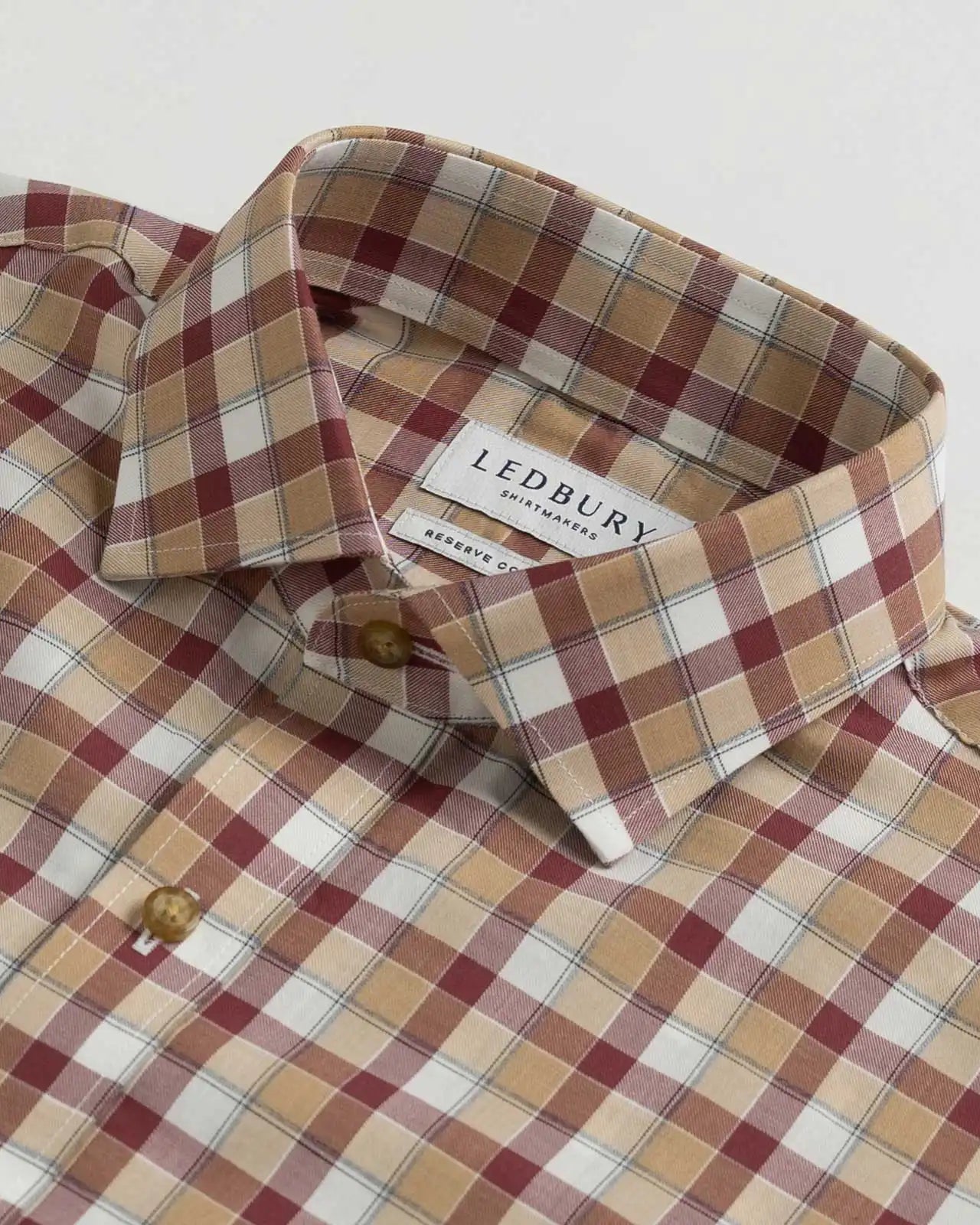Collar detail showing Italian woven Albini Calloway plaid craftsmanship
