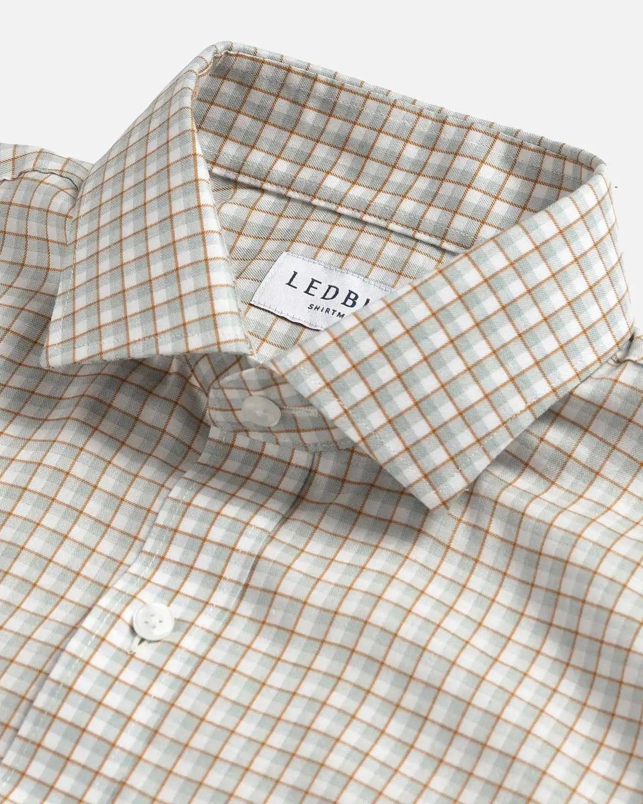 Light sage Newhall check shirt collar close-up - subtle check detail and expert tailoring