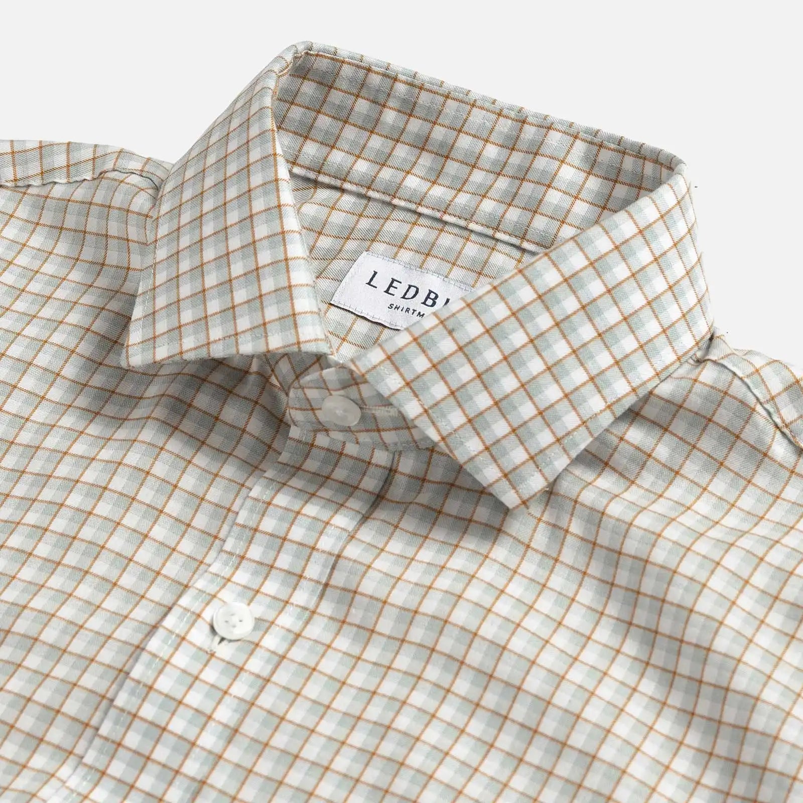 Light sage Newhall check shirt collar close-up - subtle check detail and expert tailoring