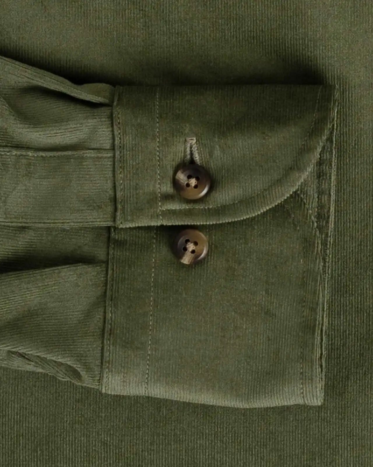 Olive green corduroy shirt cuff and sleeve construction detail