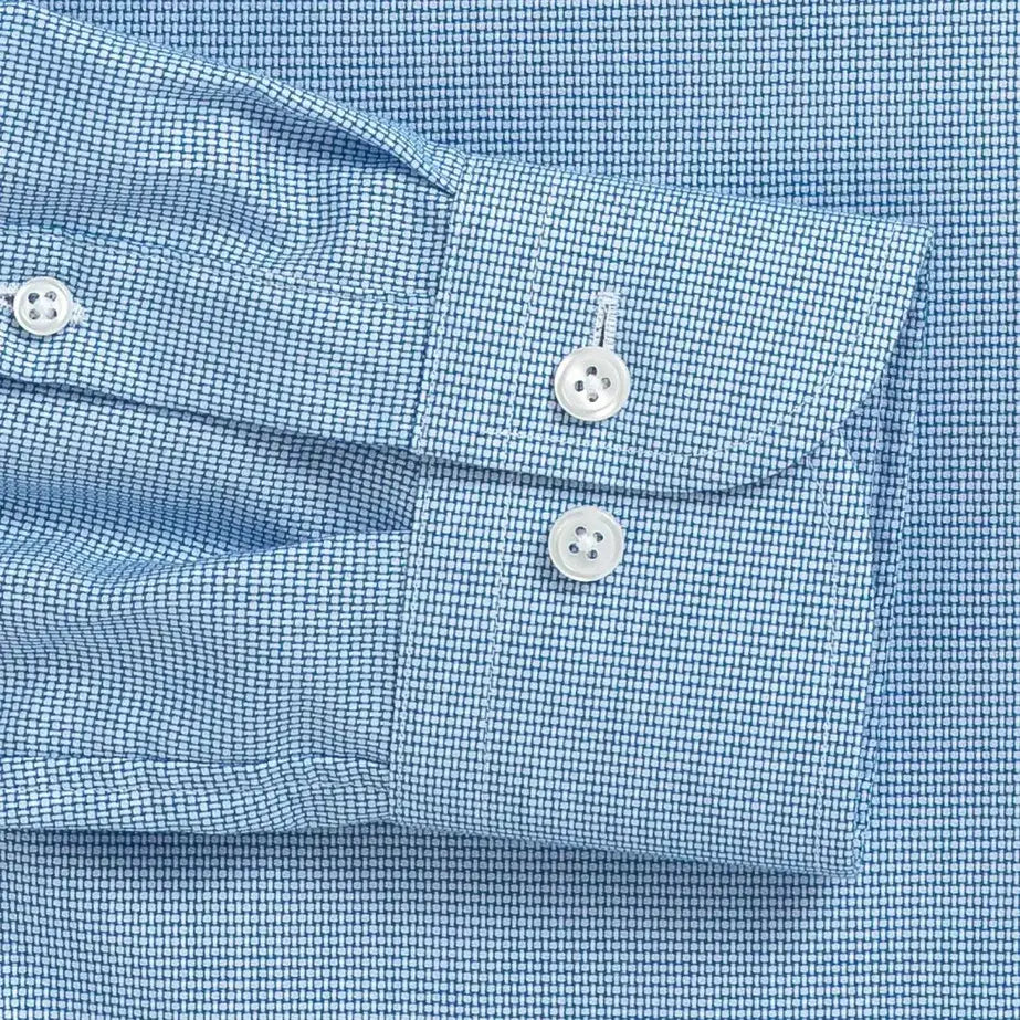 Bright blue dobby dress shirt cuff and sleeve detail