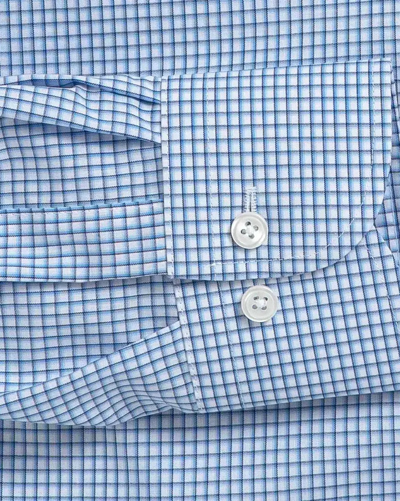 Blue check dress shirt cuff and sleeve construction detail