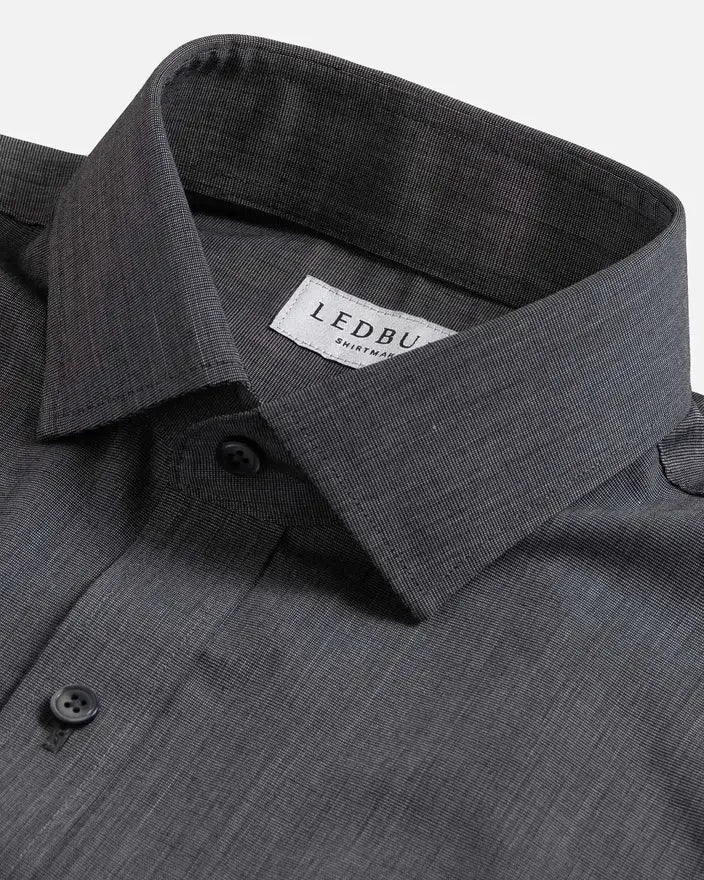 Close-up of a dark gray textured dress shirt collar with a visible LEDBURY brand label on a light gray background.