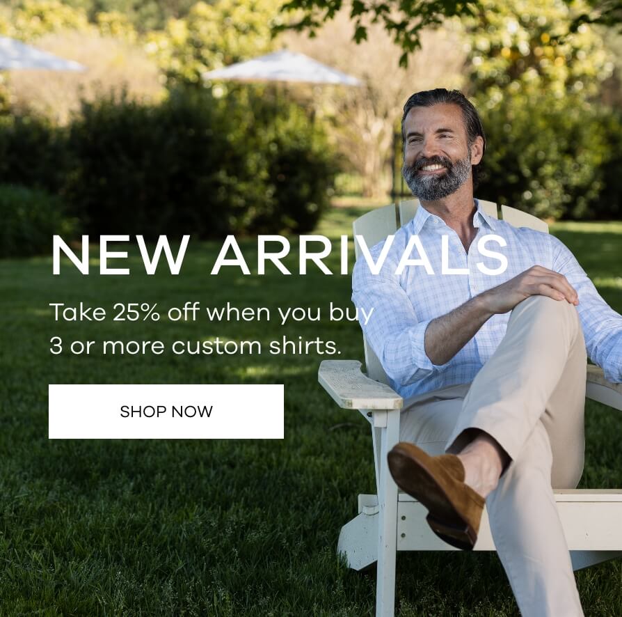 Male model sitting in an adirondack chair in a grassy area. He is wearing a Ledbury button down dress shirt in pale green checks. 