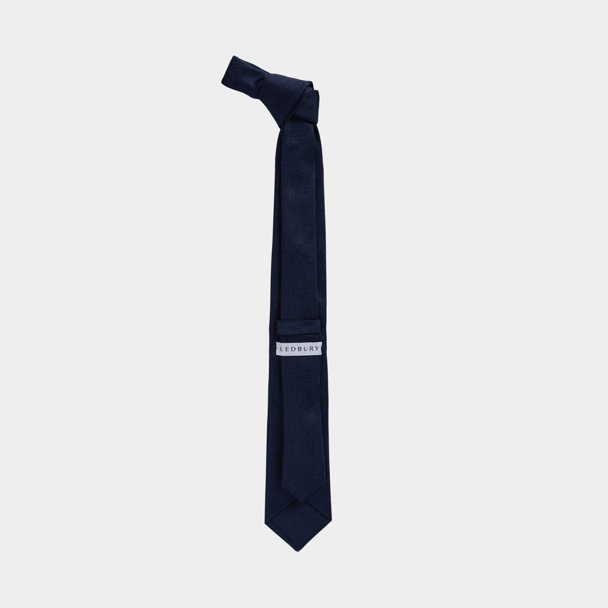 Full length back view of the Navy Barone silk tie — modern width by Ledbury