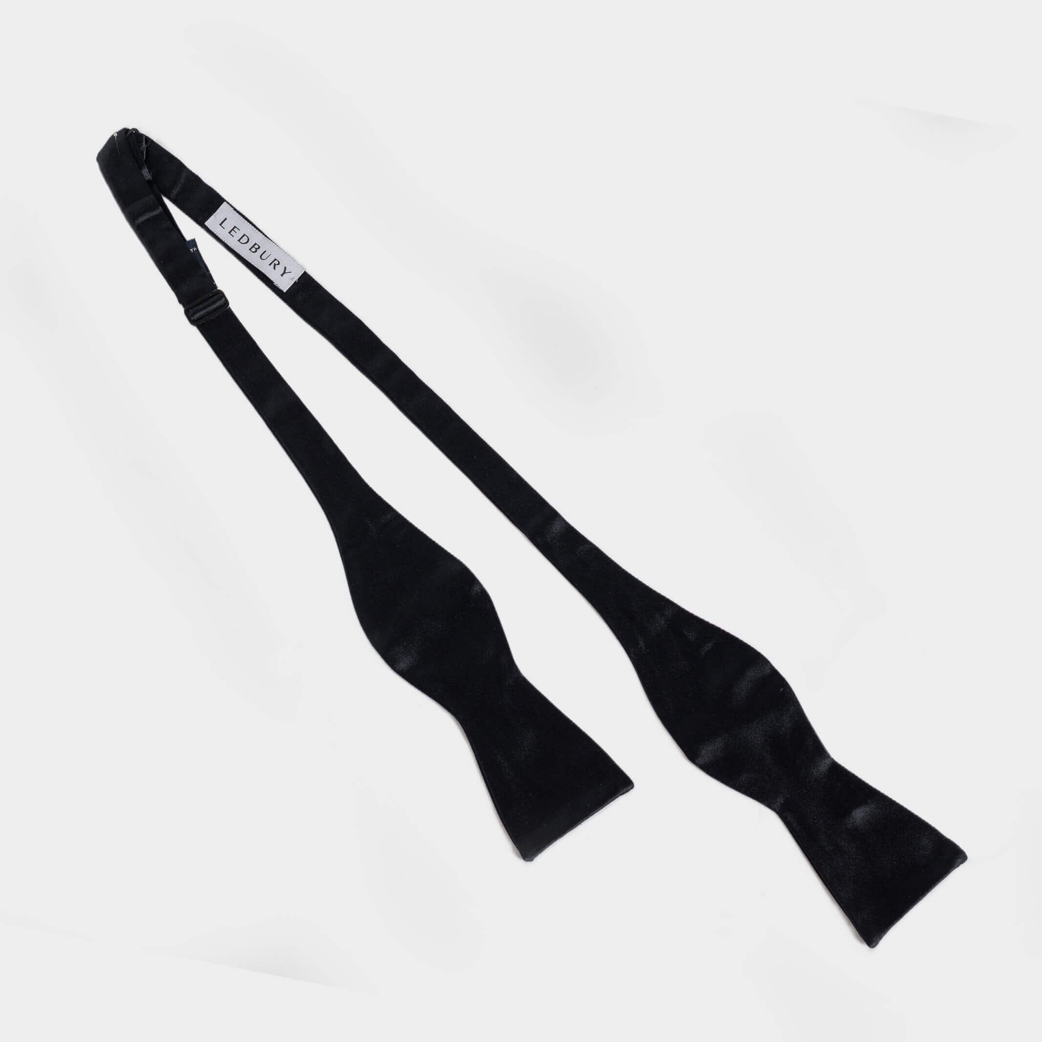 Black Carlo silk bow tie detail view — satin weave finish by Ledbury