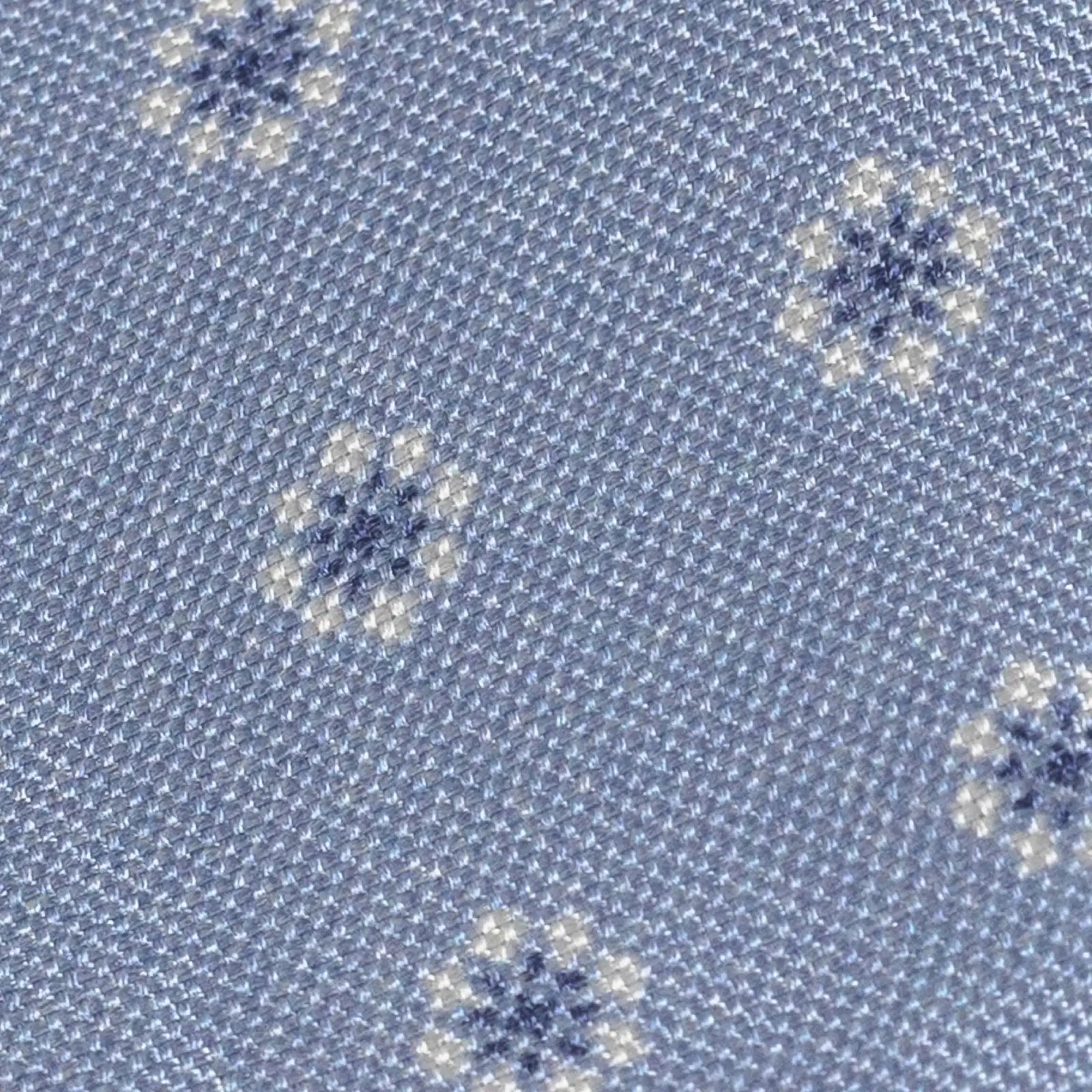 Close-up of Ledbury Light Blue Moretti Floral Silk Tie showing printed floral pattern and sheen