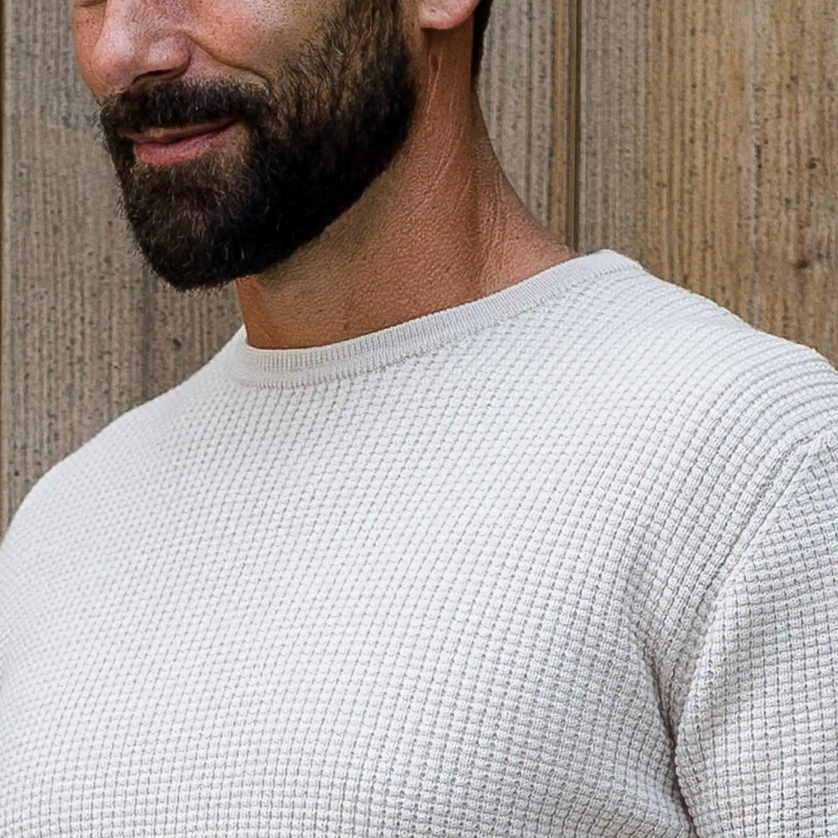 Closeup of the collar of the men's cream merino waffle knit crew neck sweater by Ledbury