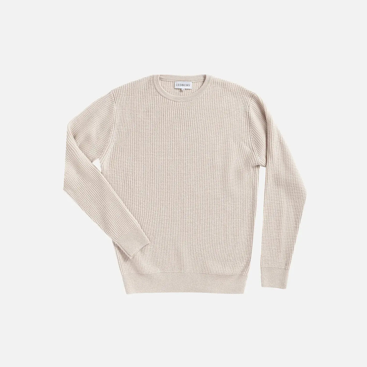 A cream waffle knit Italian merino sweater by Ledbury