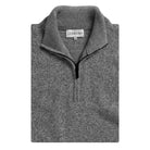 A folded gray heathered knit quarter-zip sweater with a ribbed mock neck collar, featuring a visible LEDBURY brand label inside the collar.