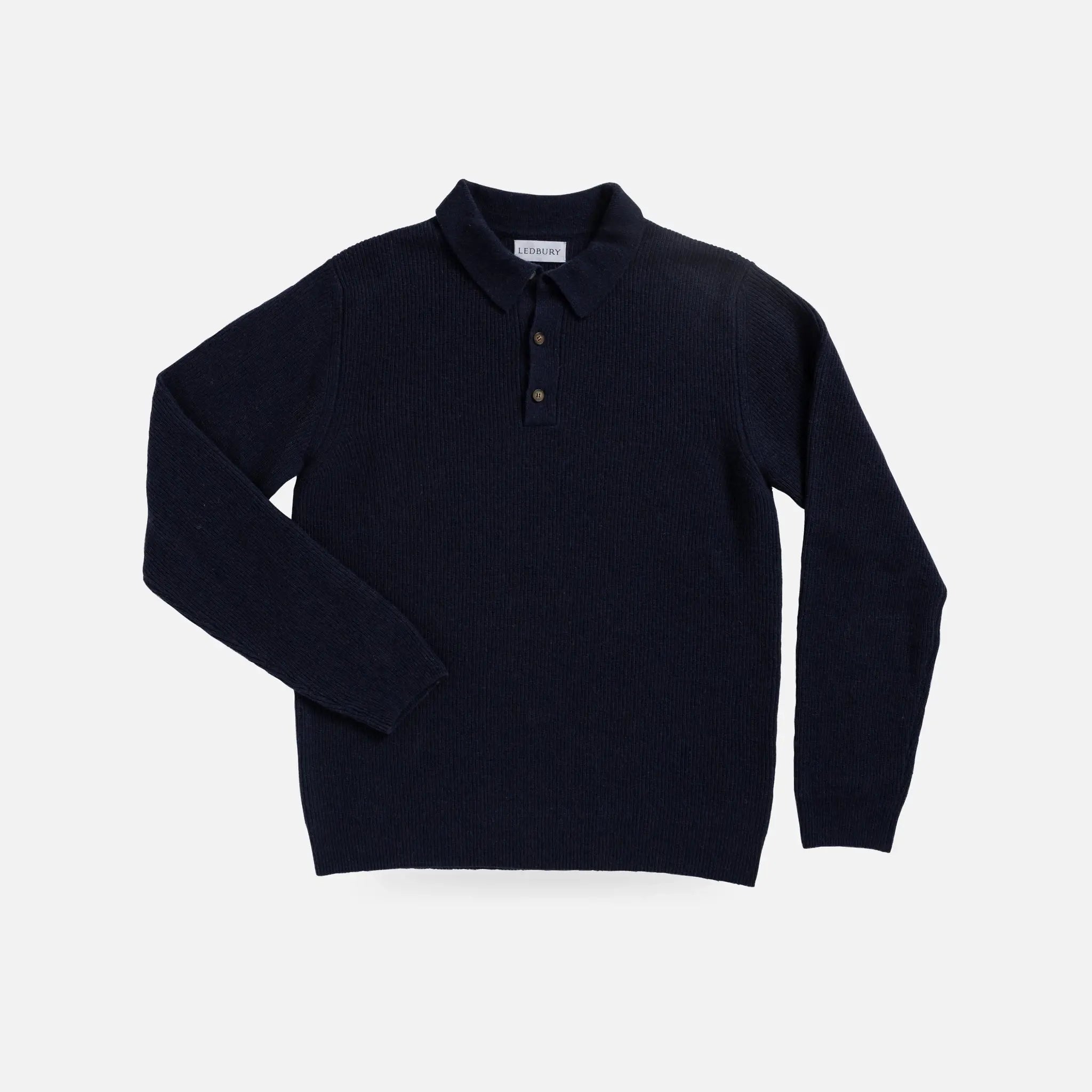 A dark navy blue ribbed knit polo sweater with a three-button placket, displayed flat against a light gray background.