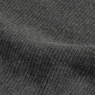Close-up of a charcoal gray ribbed knit fabric texture.