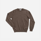 A brown long-sleeve crewneck sweater laid flat against a light gray background.