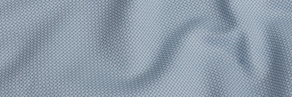Closeup of the fabric of a men's seafoam green non iron dress shirt